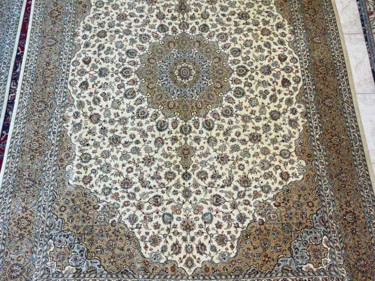Hand-knotted Kashan silk carpet on the Al Malakia showroom floor, available to Al Ain customers with free delivery