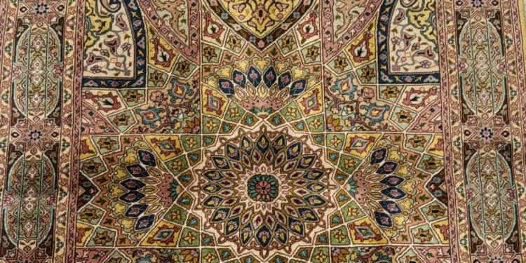 Hand-knotted Tabriz pure silk carpet on the floor of the Al Malakia showroom in Sharjah Central Souq