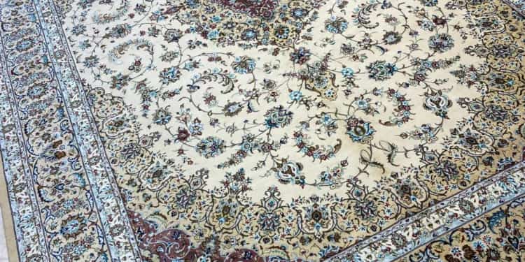 Hand-knotted Kashan silk carpet laid out on the Al Malakia showroom floor in Sharjah