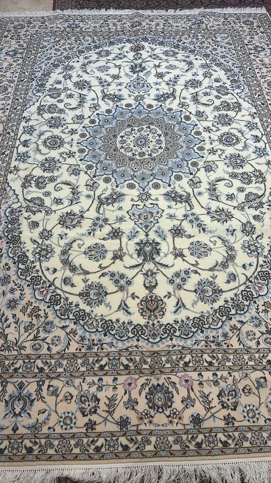 Hand-knotted Nain wool carpet, 2 × 3 m, on the Al Malakia showroom floor