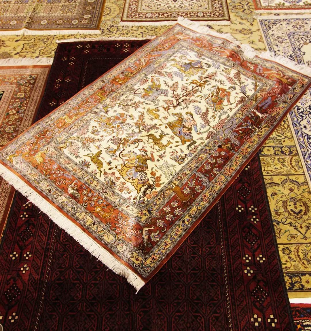 Persian carpets layered on the showroom floor